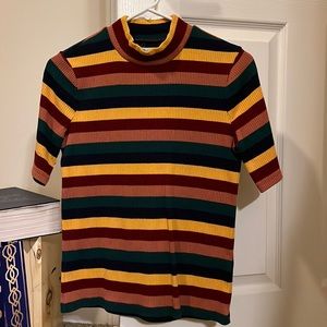 Short sleeve mock neck shirt.